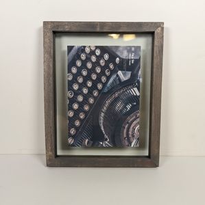 Picture Frame in grayish color and it's 7in × 5in.